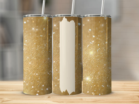 Gold glitter tumblers with a beige stripe, displayed on a wooden surface.