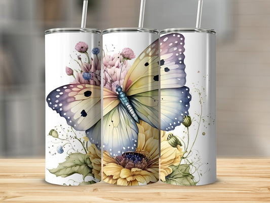 Tumbler with a butterfly and floral design.