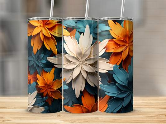 Three floral pattern tumblers with straws on a wooden surface.
