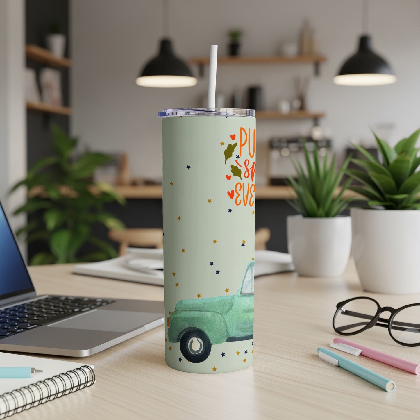Green tumbler with pumpkins and leaves design, "Pumpkin everything" text.