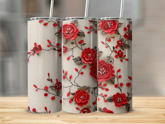 Three cream tumblers with red embroidered floral designs and silver accents.