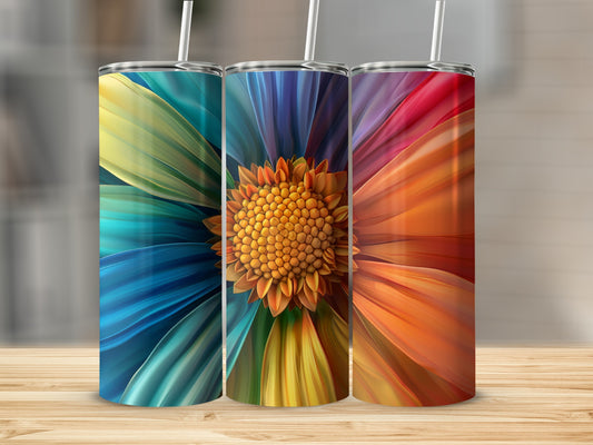 Three tumblers displaying a colorful flower design with straws.