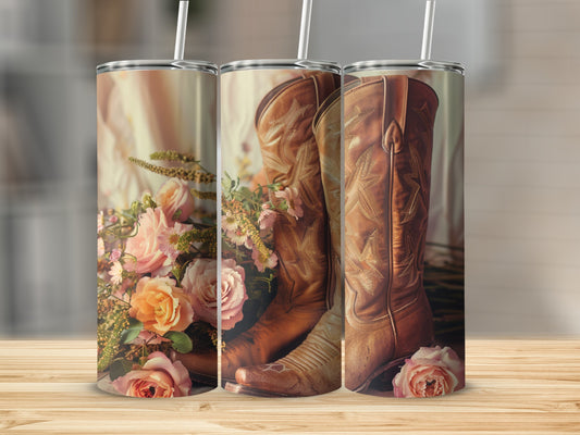 Brown cowboy boots with pink roses and greenery, shown on a tumbler.
