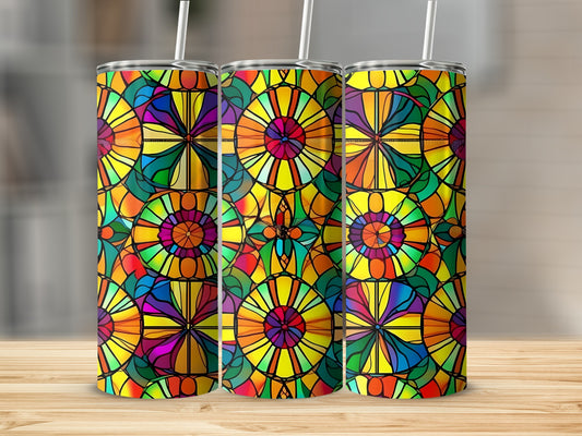 Three tumblers with colorful stained glass patterns on a wooden surface.