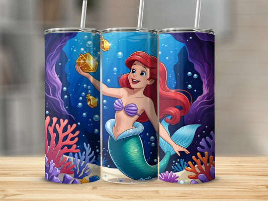 Ariel the mermaid holds a golden treasure chest underwater surrounded by coral.