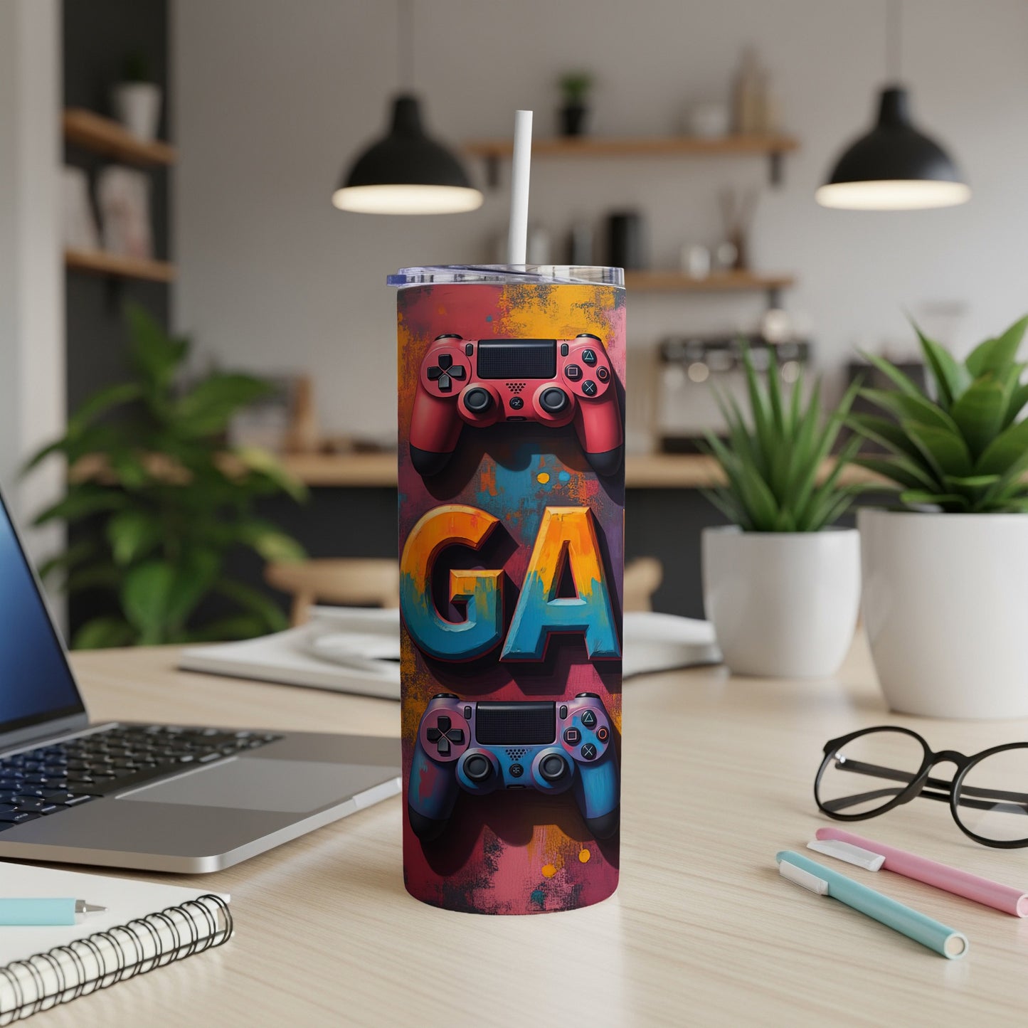 Tumbler with colorful "GA" text and two game controllers.