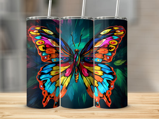 Vibrant butterfly design on three tumblers with straws.