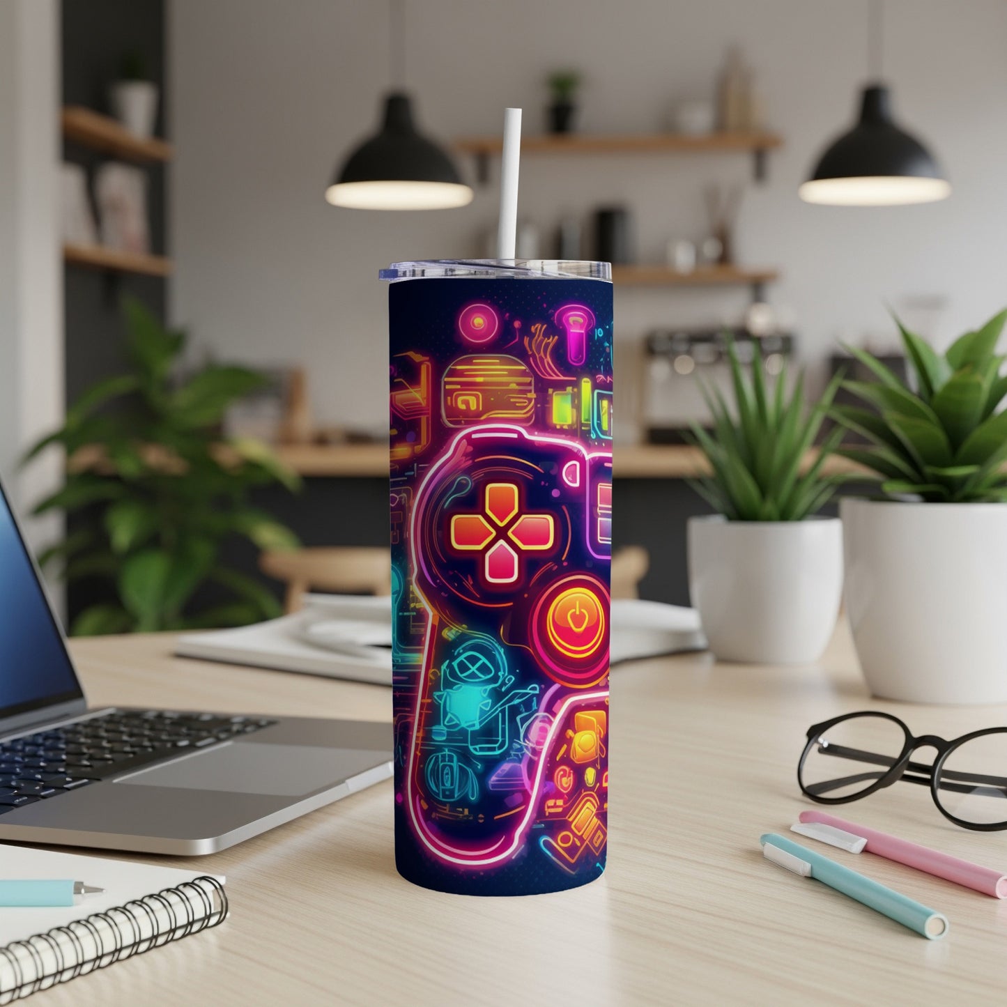 Neon gaming controller pattern on a dark blue tumbler with a straw.