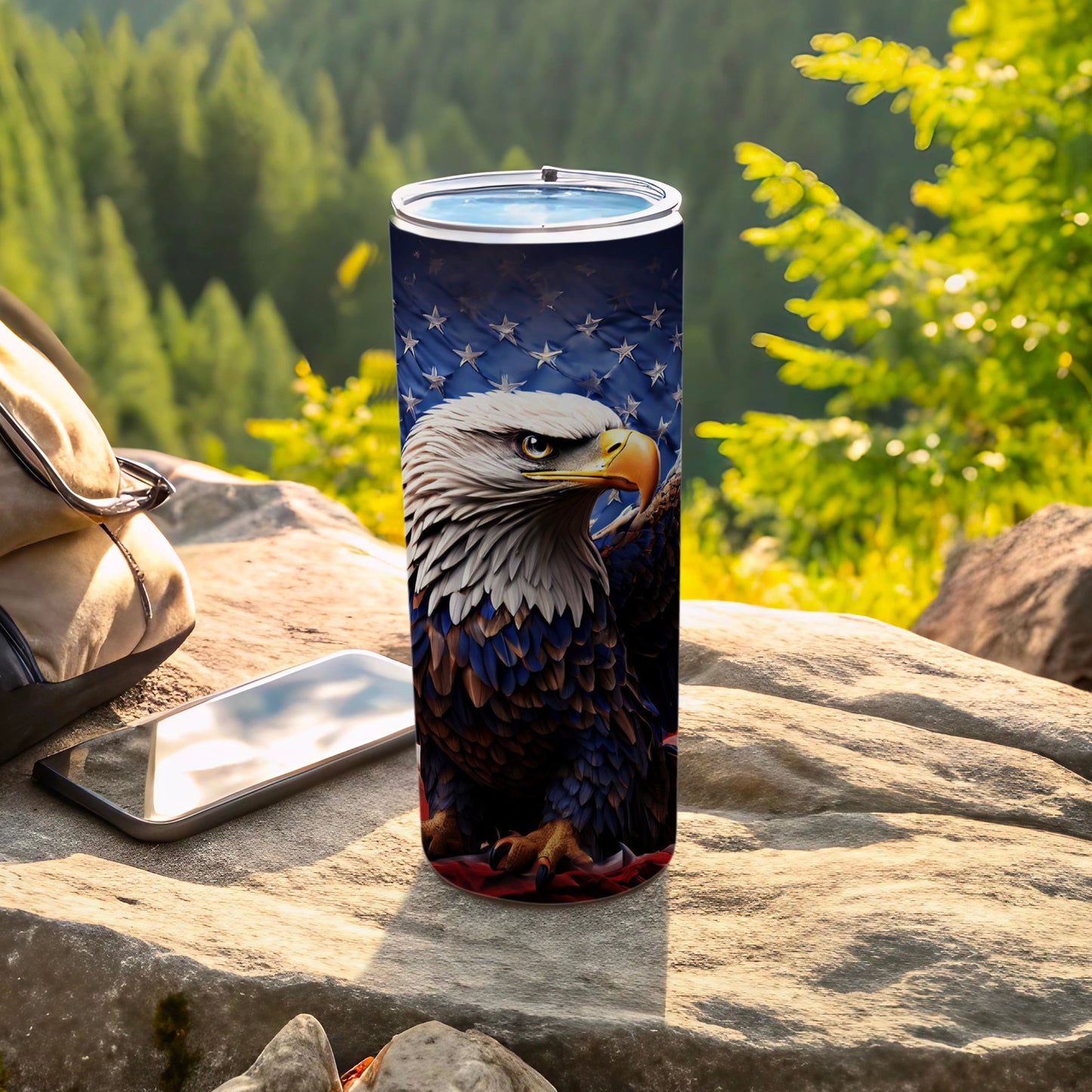 Tumbler featuring a bald eagle against the American flag on a stone surface.