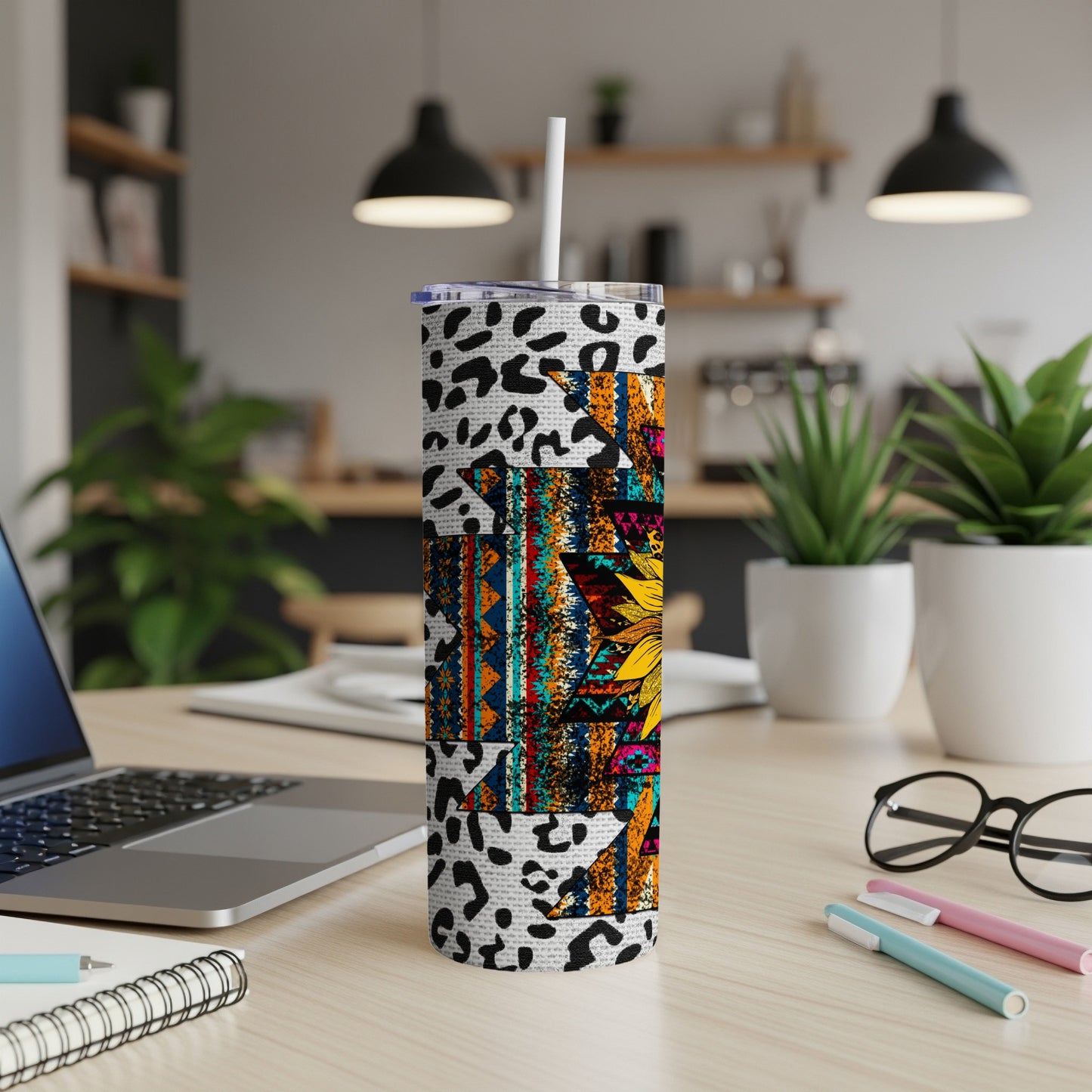 Tall tumbler with a patterned wrap featuring leopard print and a sunflower design.