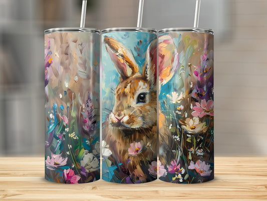 Bunny with flowers painted on three tumblers.