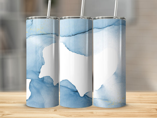 Three tumblers with blue watercolor and gold accents, on a wooden surface.
