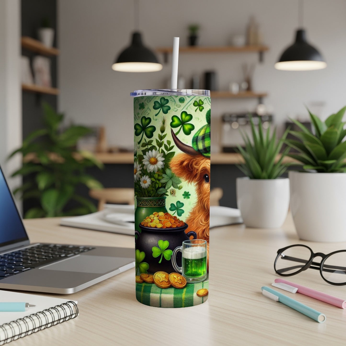 Highland cow with shamrocks and gold coins on a St. Patrick's Day tumbler.