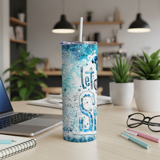 Tall skinny tumbler with snowflake design and "Let it Snow" text.