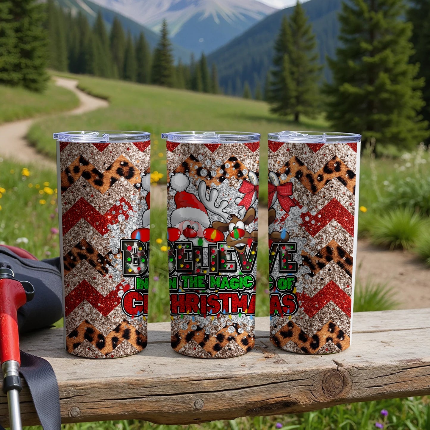 Three festive Christmas tumblers with glitter, cheetah print, and "Believe in the Magic of Christmas" text.