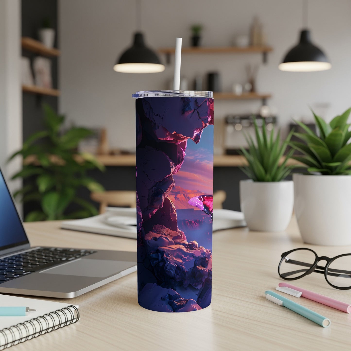 Purple tumbler with glowing butterfly on a rocky cliff at sunset.