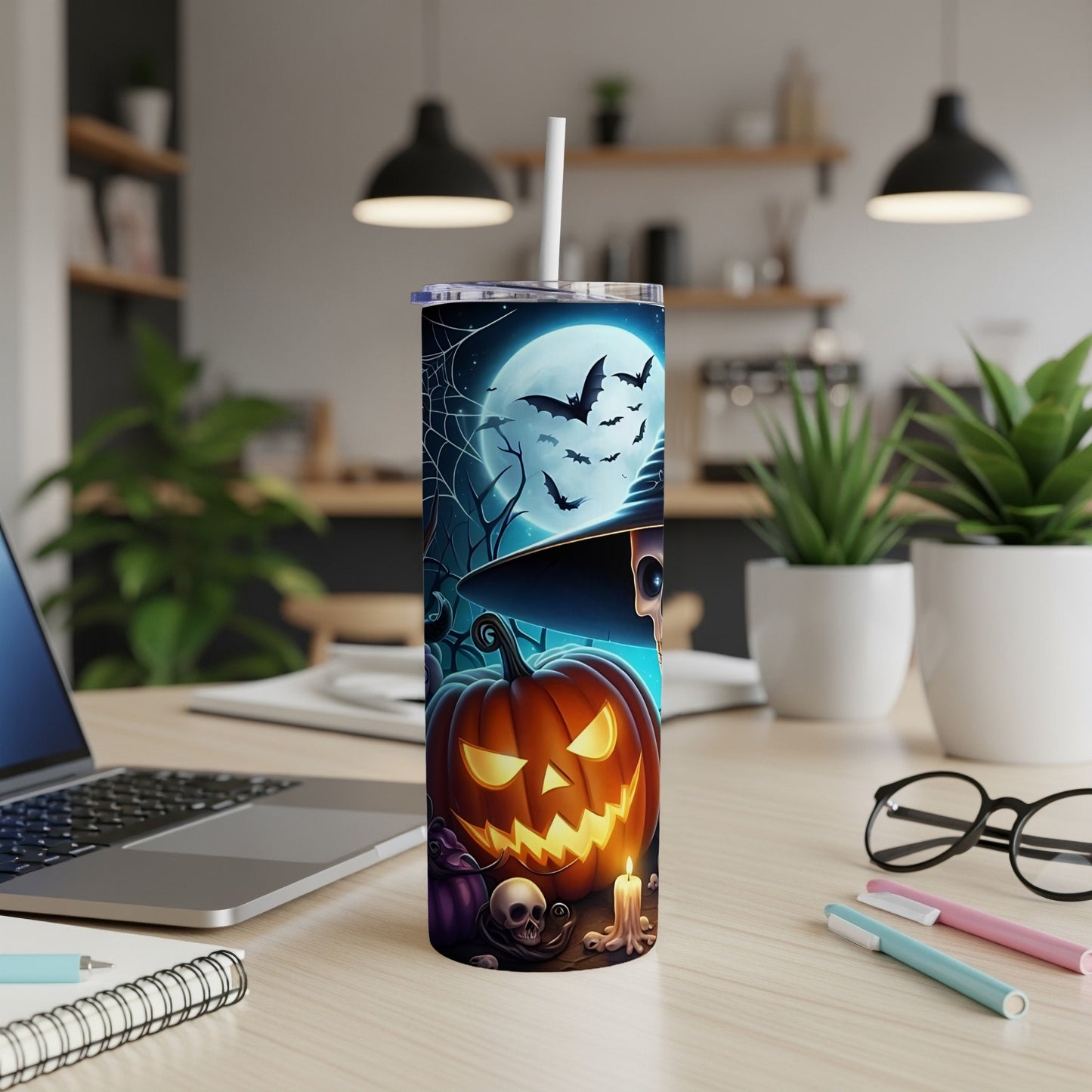 Halloween tumbler with grinning pumpkin, skull, bats, and full moon.