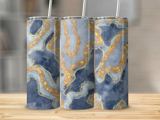 Three tumblers with blue watercolor and gold vein pattern on wooden surface.