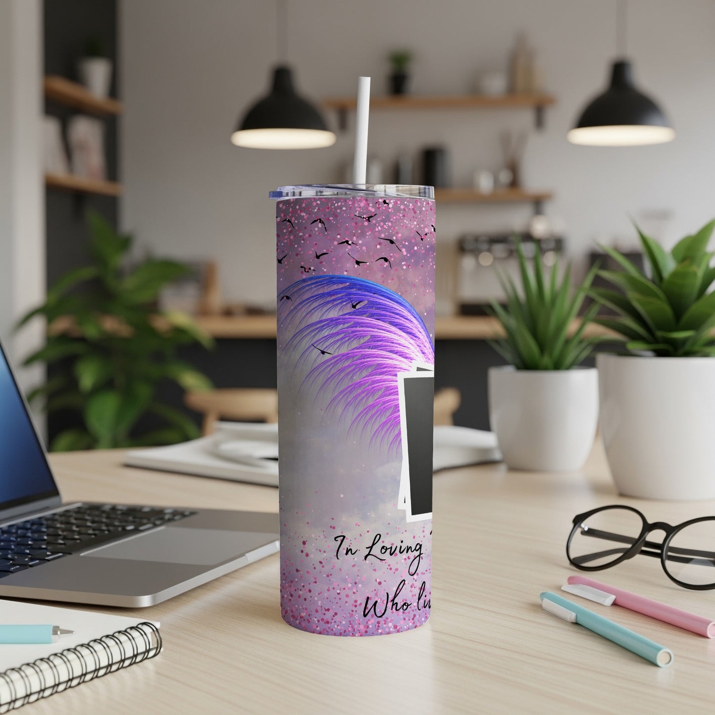 Purple glitter tumbler with abstract feathers, birds, and text that reads "In Loving Who Li".