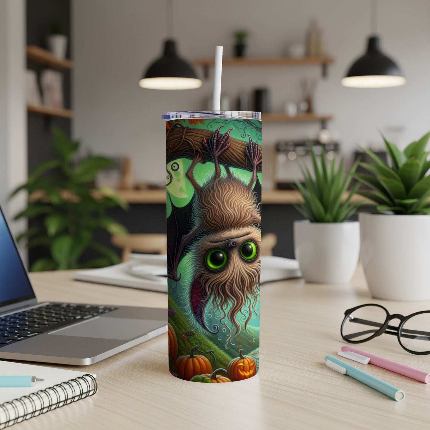 Halloween tumbler with a furry bat and pumpkins on a green background.