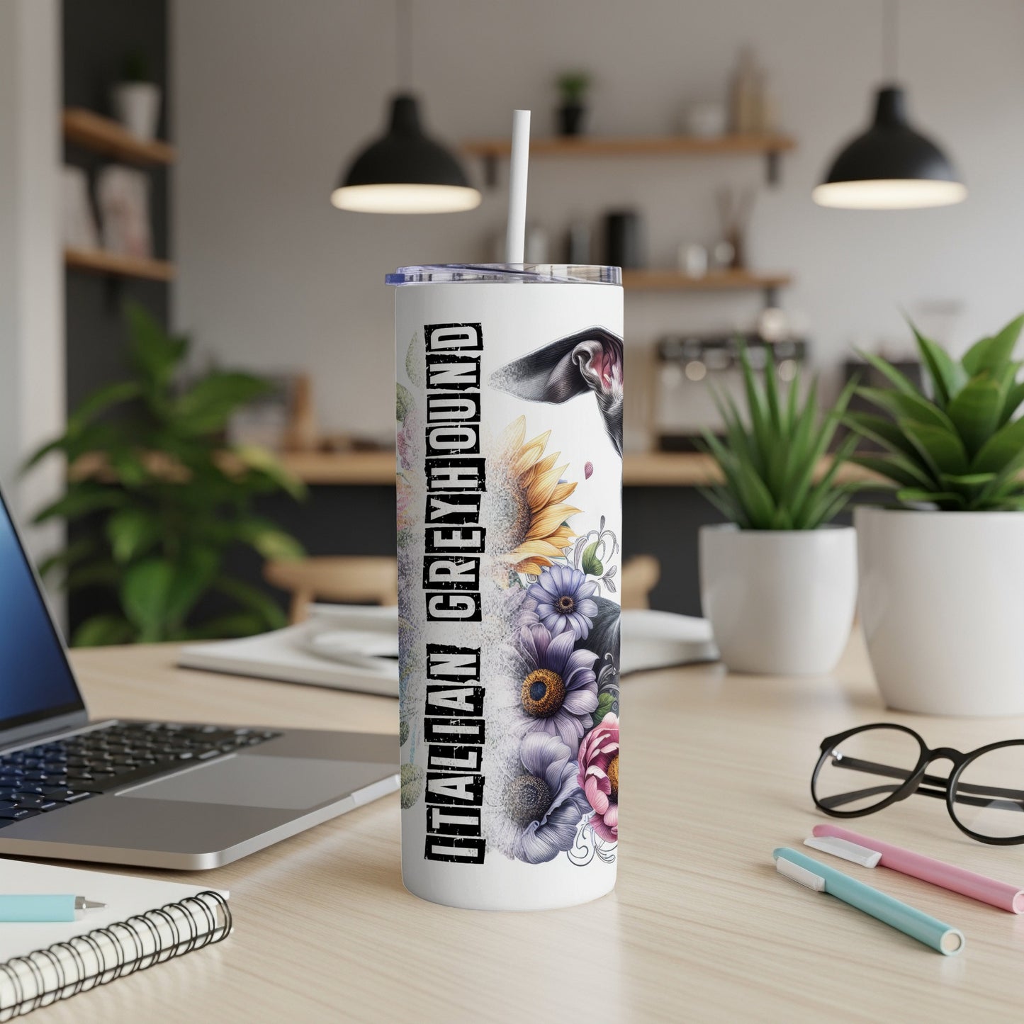 Tall tumbler with Italian Greyhound and floral design on desk.