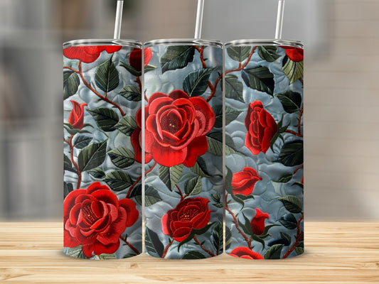 Three tumblers featuring a raised red rose floral pattern on a blue background.