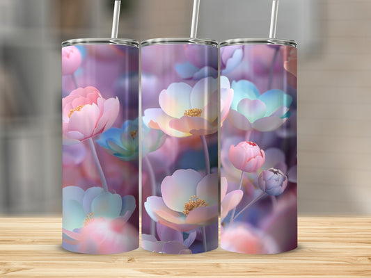 Three tumblers with a pastel floral design stand on a wooden surface.
