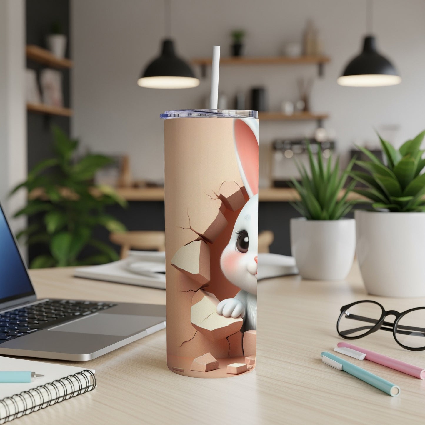 White bunny peeking through cracked beige background on a tumbler with straw.