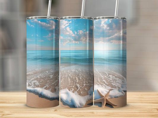 Beach scene with ocean waves, sand, and a starfish on a tumbler.