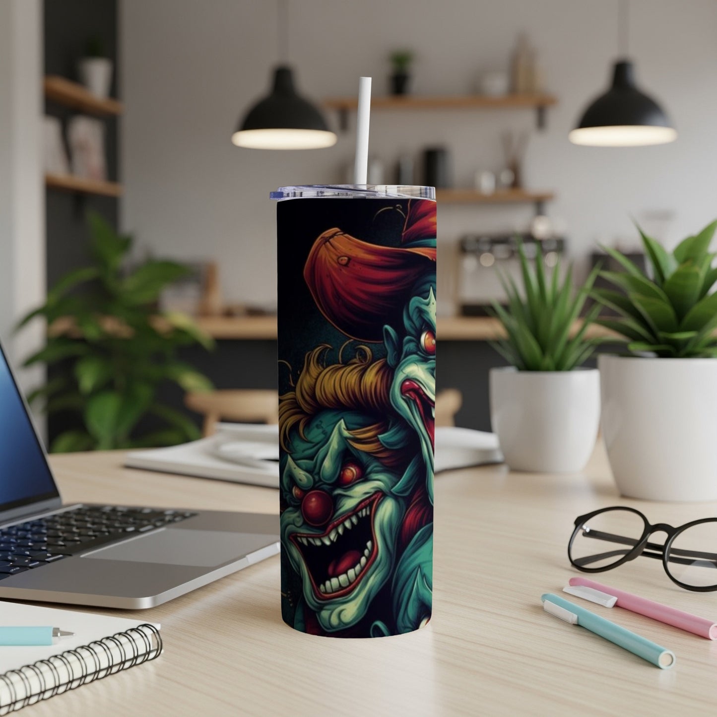 Tumbler with a creepy clown illustration featuring sharp teeth and red accents.