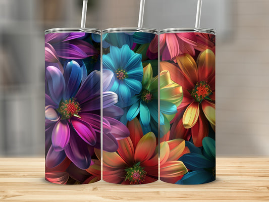 Three colorful tumblers with floral designs stand on a wooden surface.