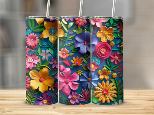 Three tumblers with colorful floral designs and white straws.