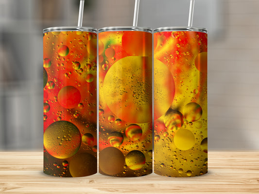 Three tumblers with colorful oil and water droplet design.