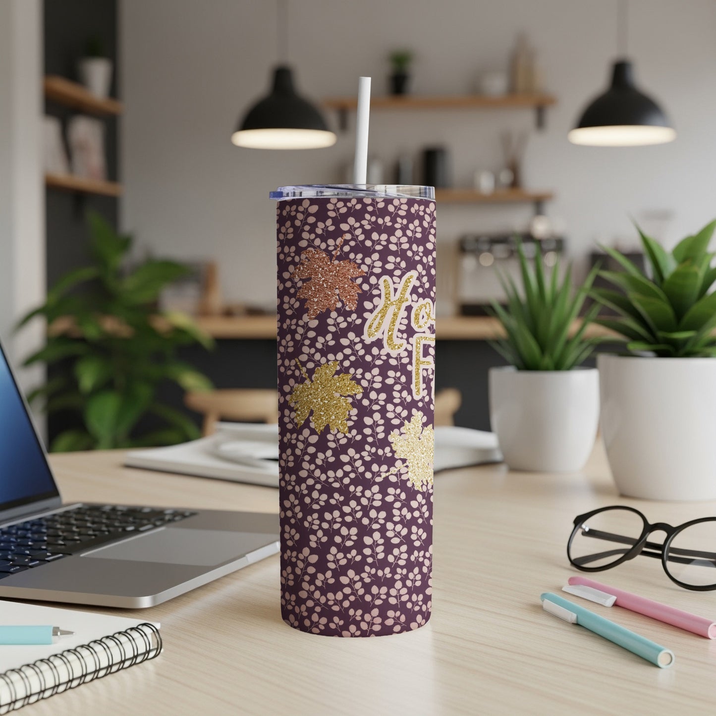 Purple tumbler with fall leaves pattern and "Mom" text.