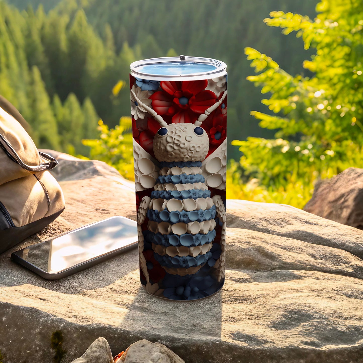 Bee patterned tumbler with a nature background and a backpack.
