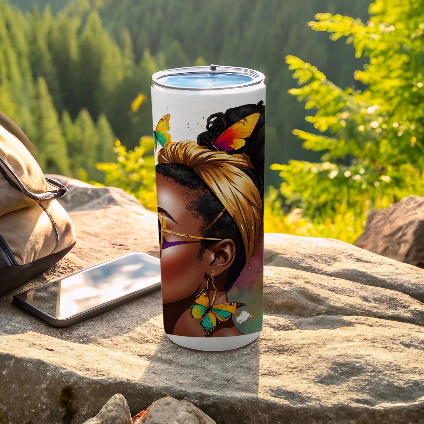 Gold tumbler with butterfly design of a woman with gold headscarf and butterfly earrings.