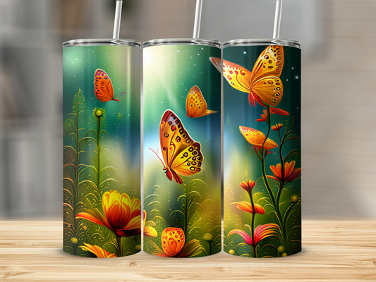 Three tumblers with vibrant butterfly and floral designs on a wooden surface.