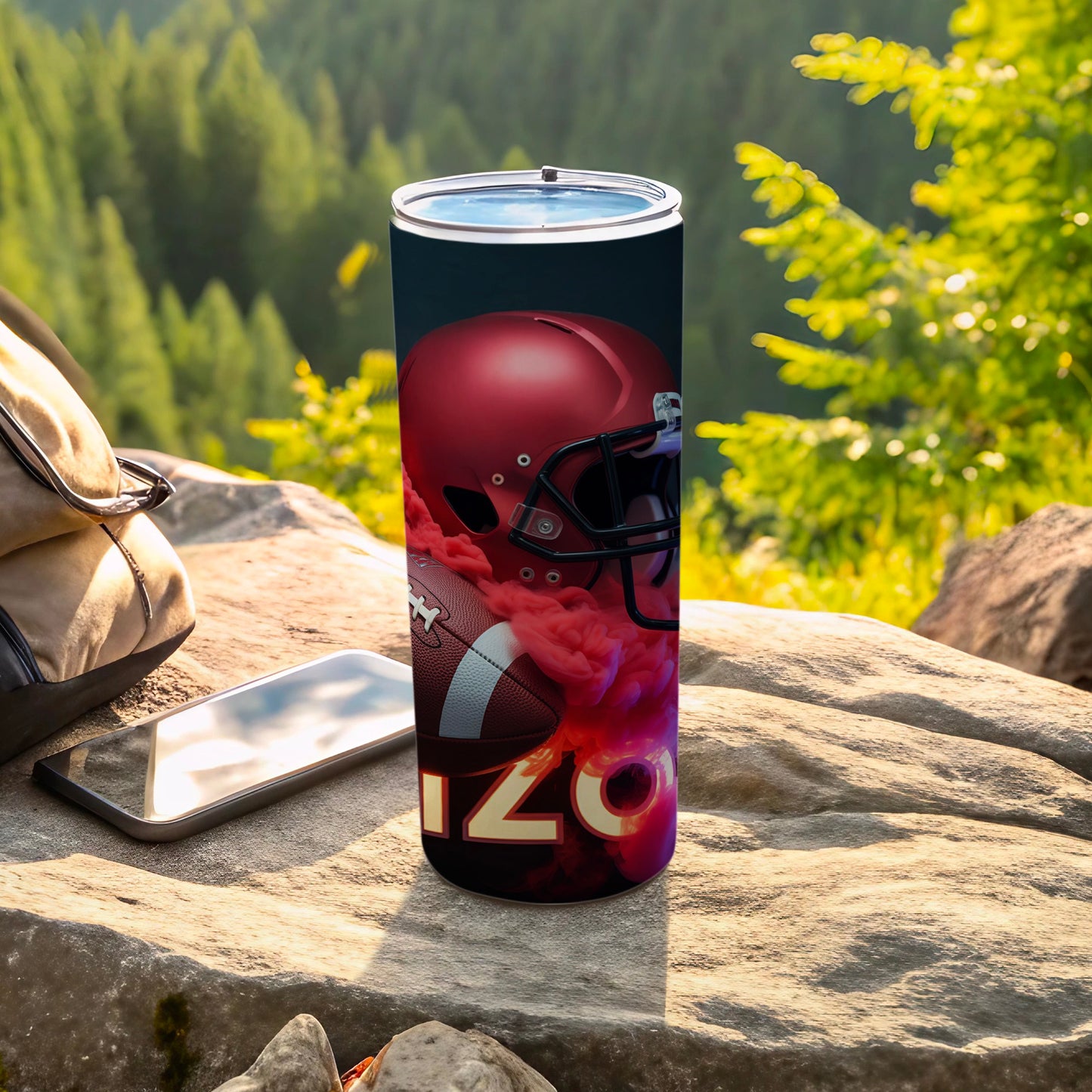 Tumbler with football, helmet, and "ARIZONA" text against a forest background.