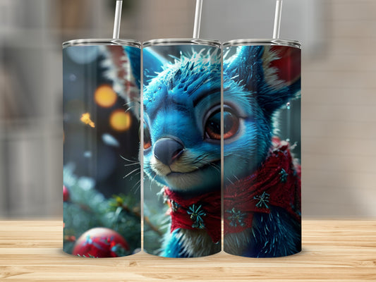 Blue fuzzy creature with red scarf on tumbler with Christmas decorations.
