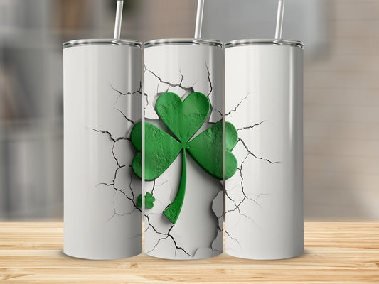 Three white tumblers with cracked surface and a green shamrock design.