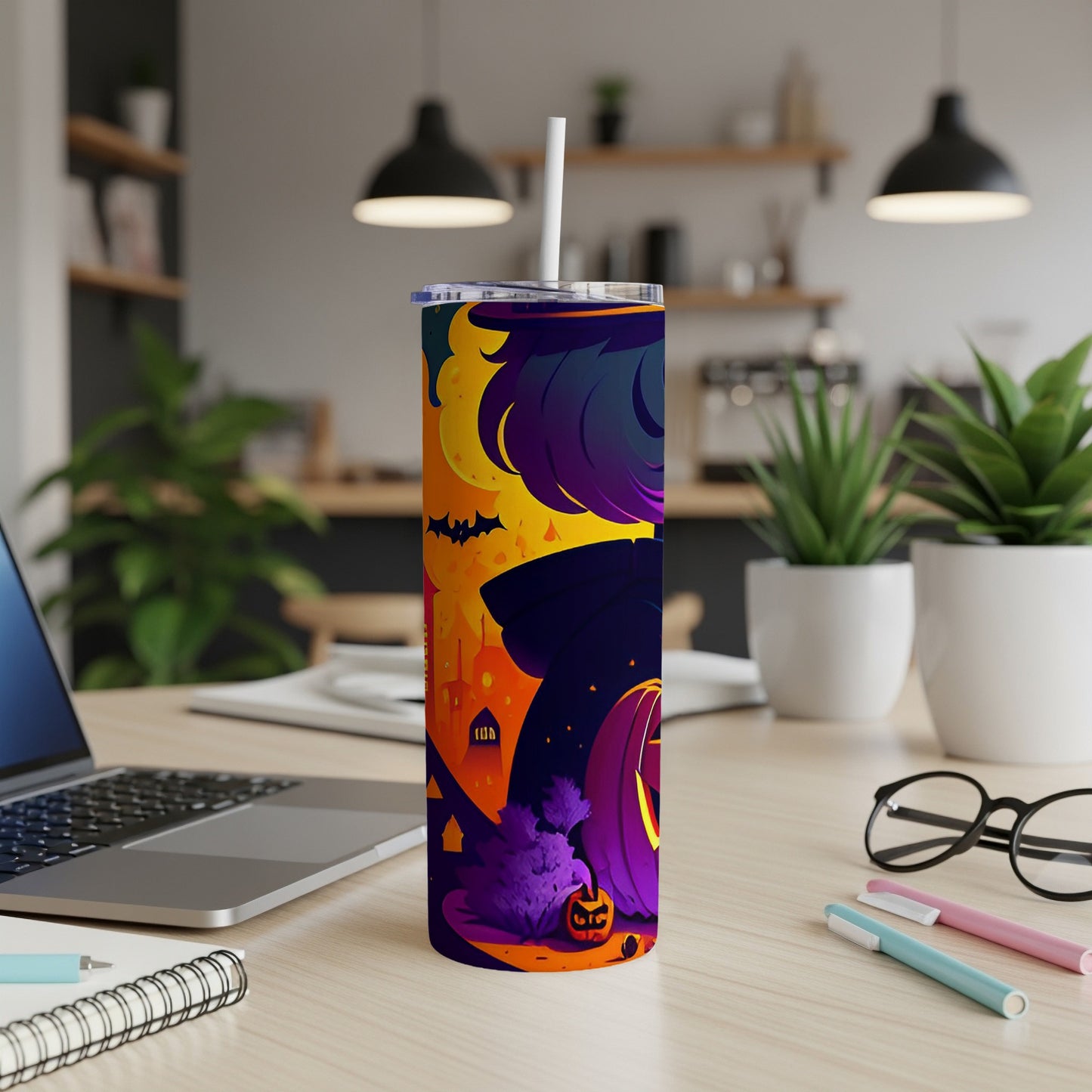 Tall tumbler with a Halloween design featuring bats, a pumpkin, and a spooky cityscape.