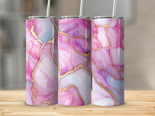 Three tall pink marble tumblers with gold veining on a wooden surface.