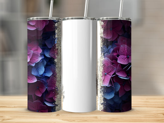 Tumbler with purple and blue floral design and glitter accents.