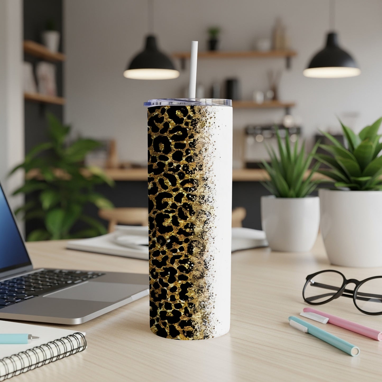White tumbler with black and gold leopard print fading to white.