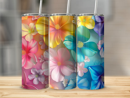 Three tumblers with colorful floral designs.