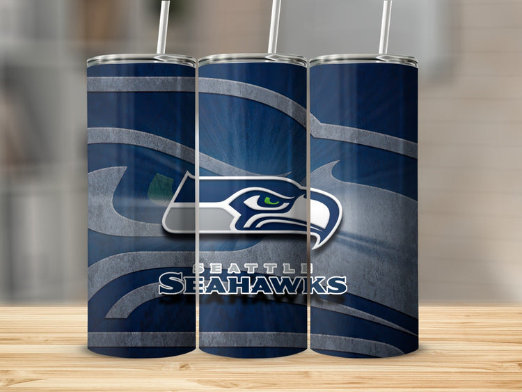Seattle Seahawks logo and text on three navy blue tumblers with straws.