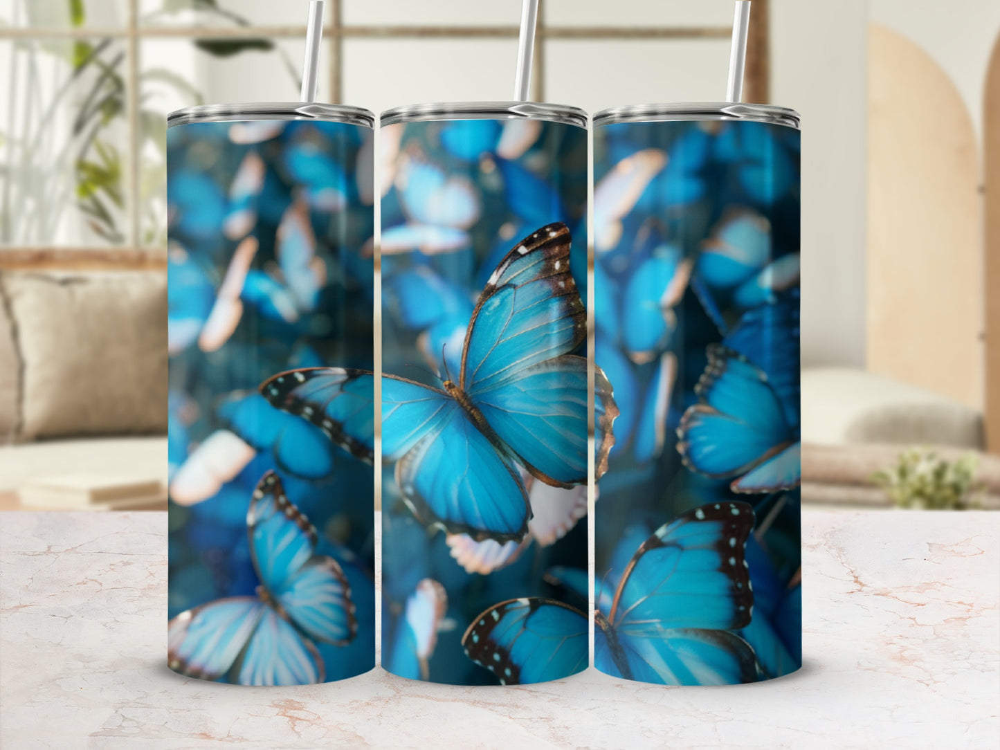 Blue butterflies on a patterned tumbler with a straw.