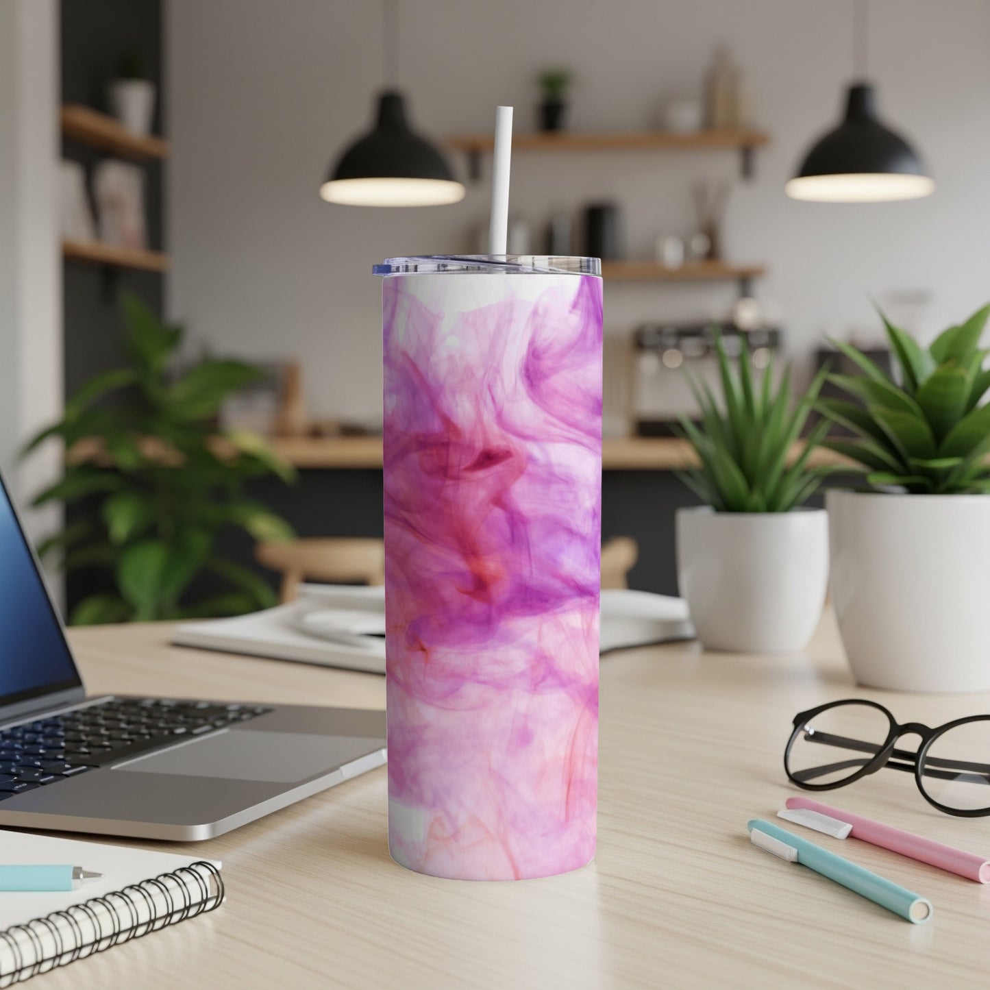 Pink and purple abstract watercolor pattern on a white skinny tumbler with straw.