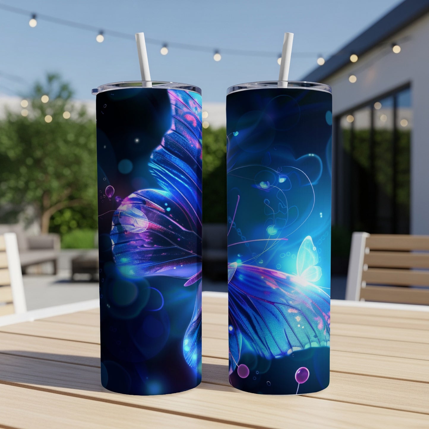 Two tumblers with blue glowing butterfly wings, resting on a table outdoors.
