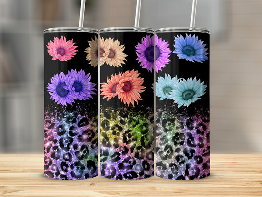 Three tumblers with floral designs and colorful leopard print.